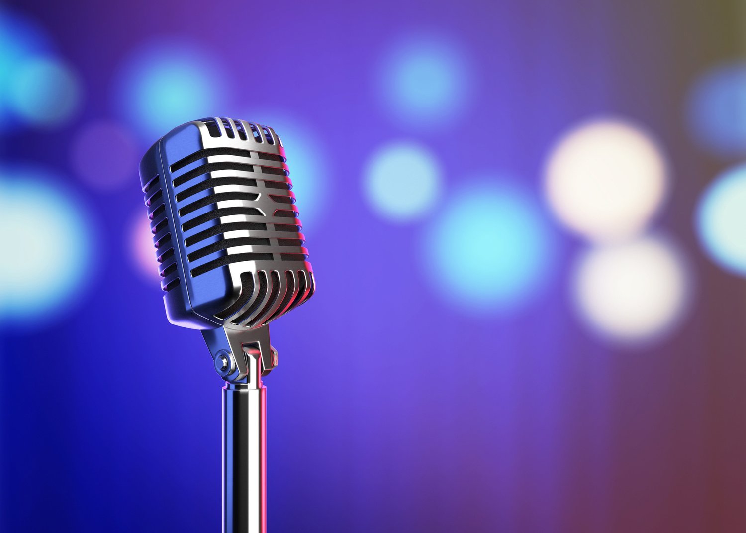 Retro microphone on stage with blurred lights.